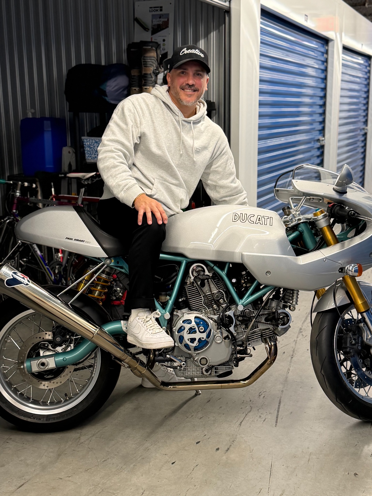 A rider seated on the silver Ducati Paul Smart 1000